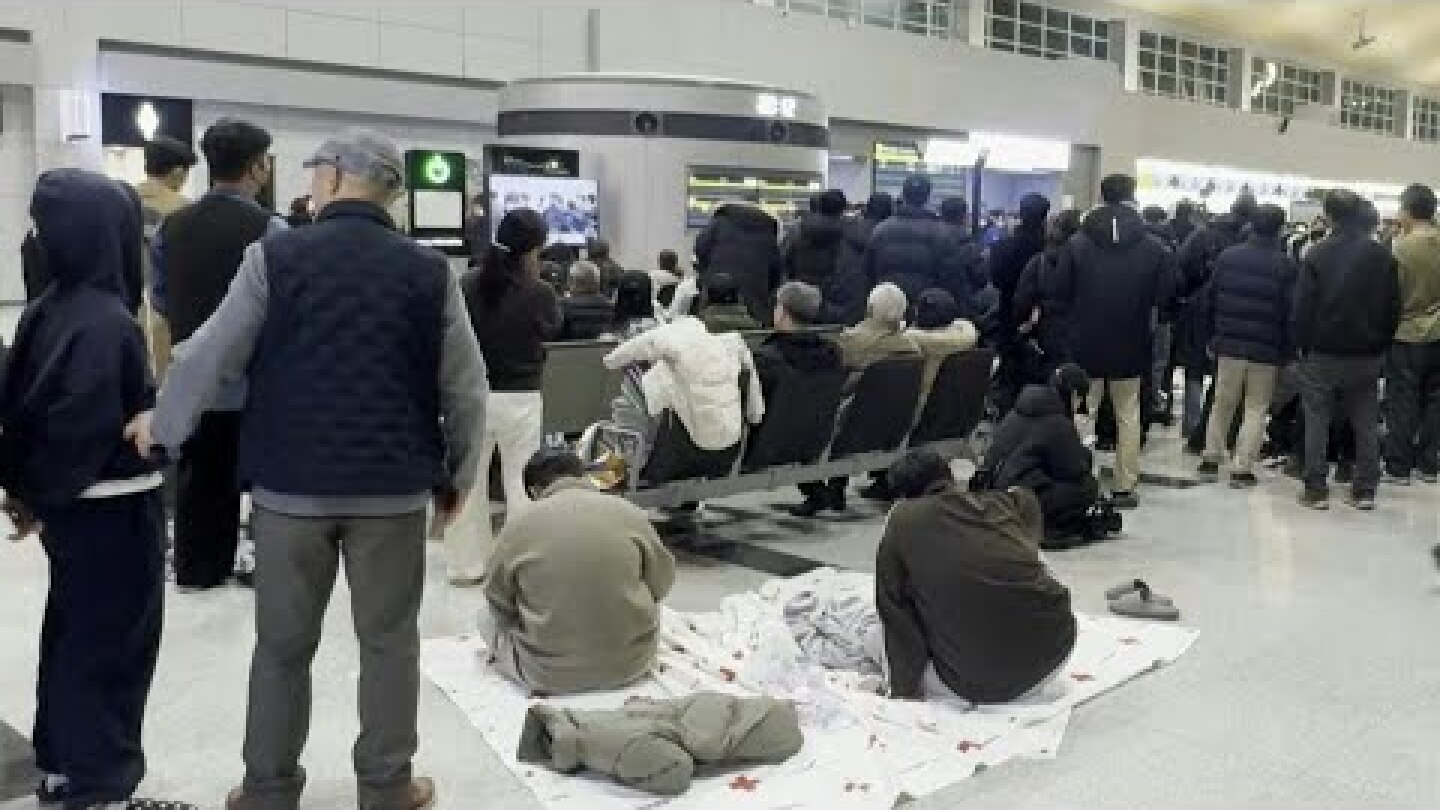 Families await news at Muan airport after South Korea plane crash | AFP