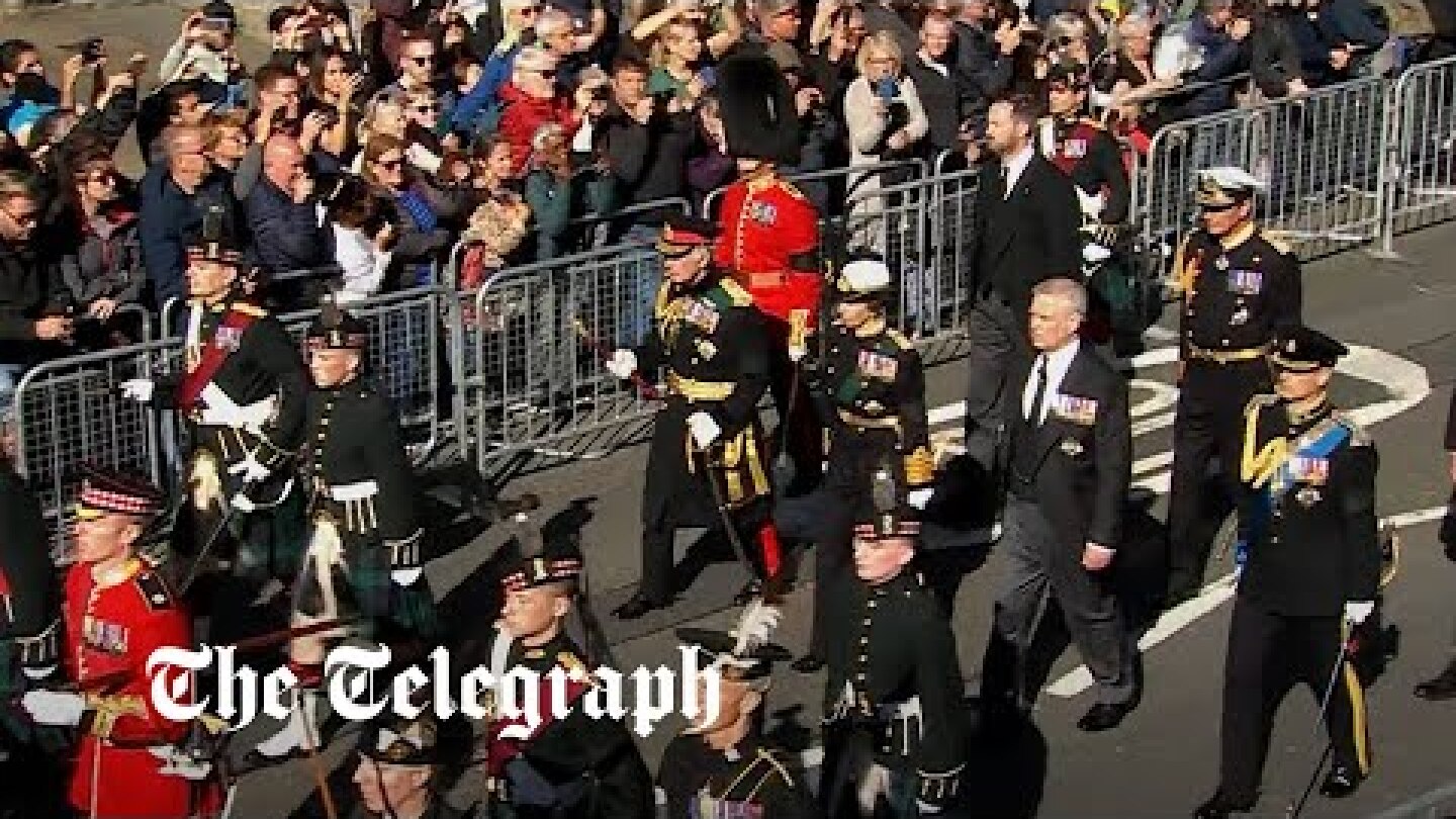 King and family march behind late queen's coffin in Edinburgh